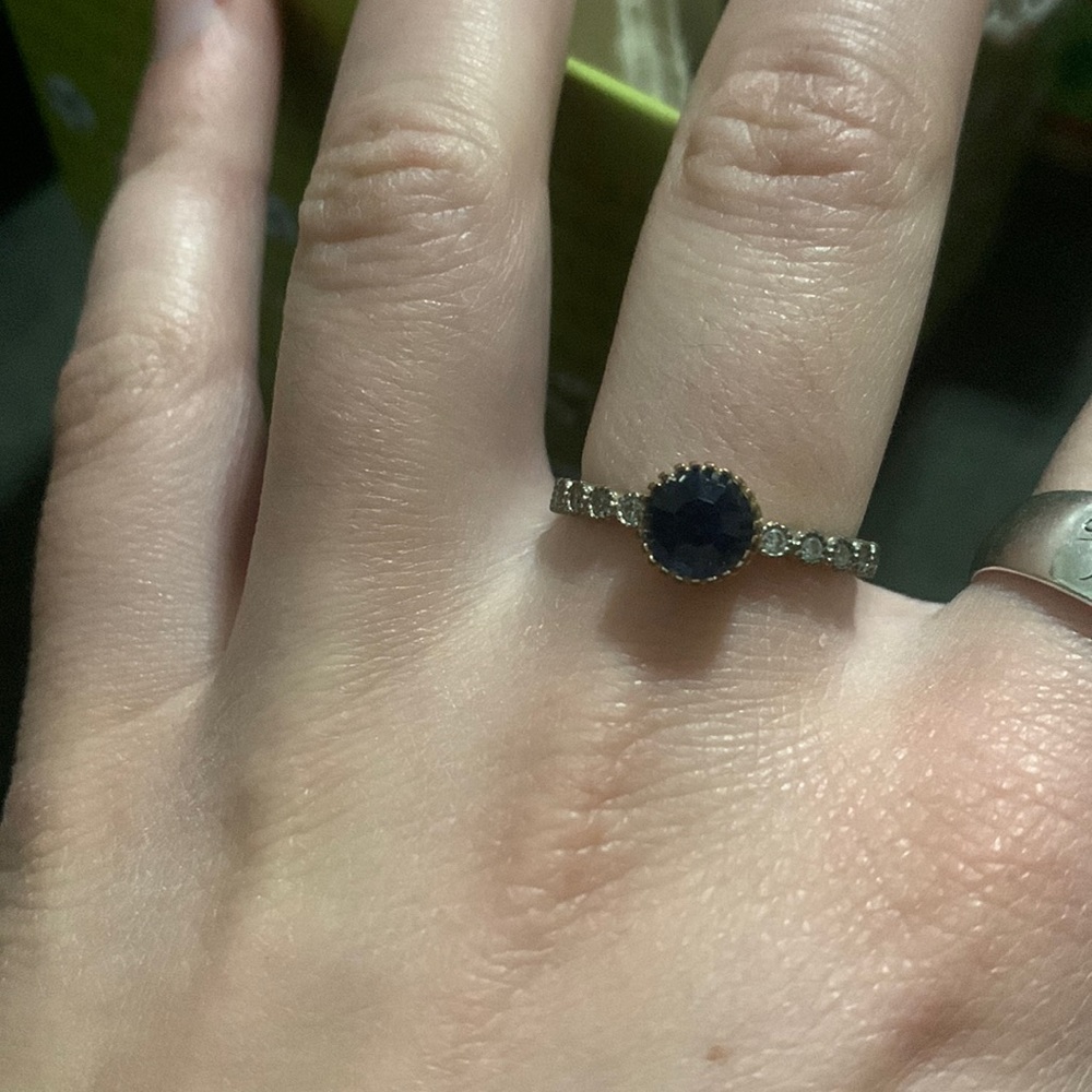 silver ring with blue gem